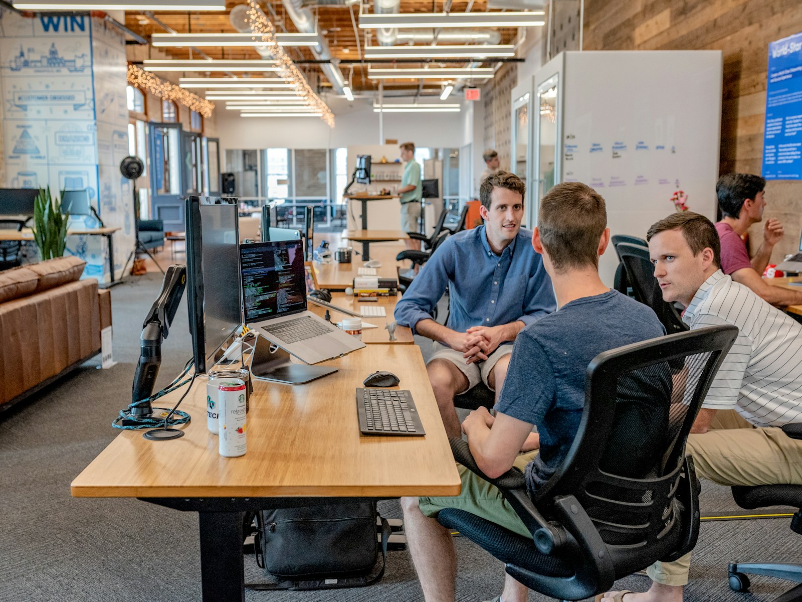 Technology colleagues reviewing a workflow in an office